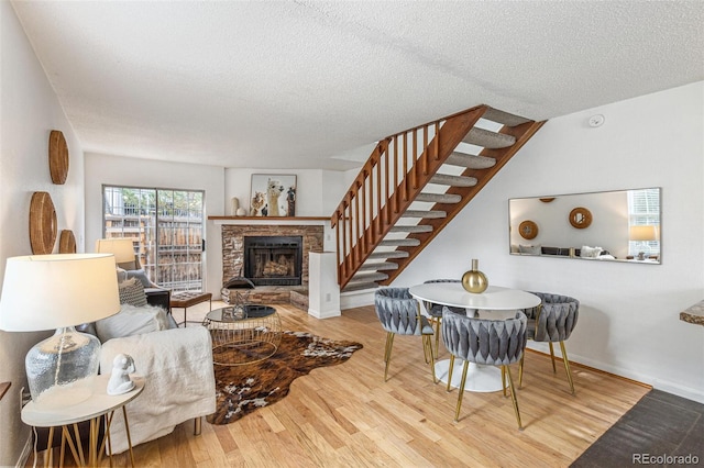 living room featuring hardwood / wood-style flooring and a textured ceiling