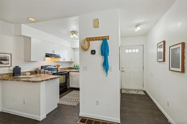 kitchen featuring white cabinetry, black range with electric stovetop, a textured ceiling, and dark stone countertops