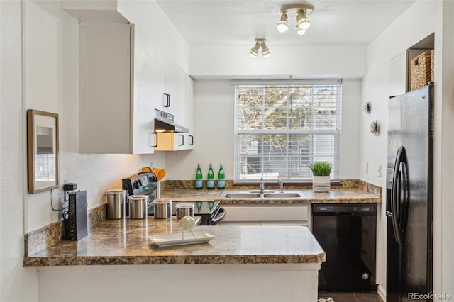 kitchen with white cabinetry, sink, and black appliances