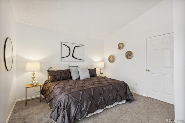 carpeted bedroom with vaulted ceiling