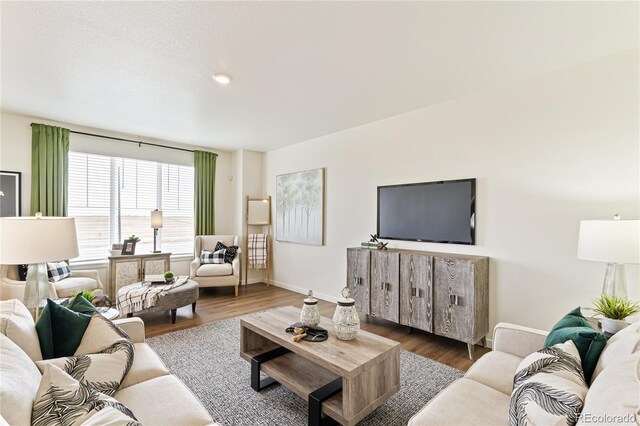 22323 E 6th Pl, Aurora, CO 80018 - living room featuring wood finished floors and baseboards