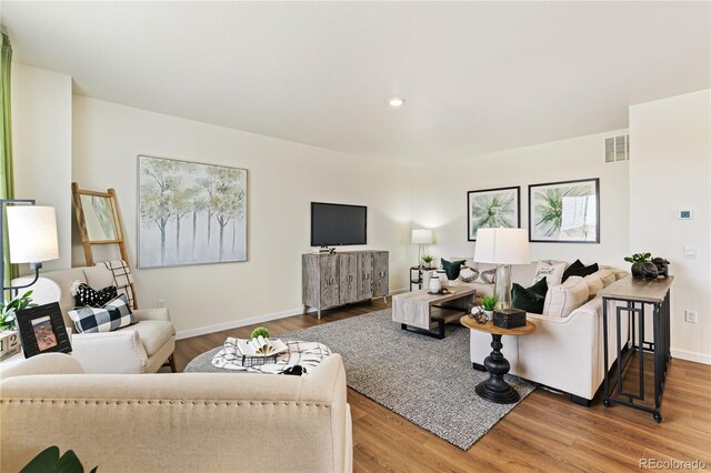 22323 E 6th Pl, Aurora, CO 80018 - living room with visible vents, baseboards, wood finished floors, and recessed lighting