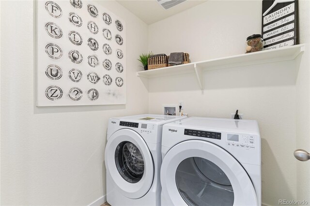 22323 E 6th Pl, Aurora, CO 80018 - laundry room with visible vents, laundry area, and independent washer and dryer