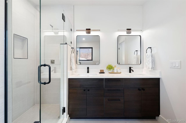 bathroom featuring vanity and a shower with shower door