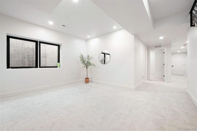 empty room featuring light colored carpet