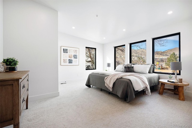 bedroom featuring recessed lighting, baseboards, and light colored carpet