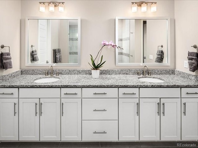bathroom featuring double vanity and a sink