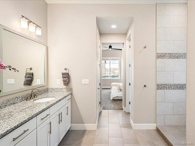 full bathroom with baseboards, ceiling fan, connected bathroom, vanity, and tile patterned flooring