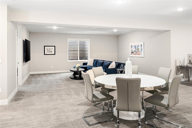 carpeted dining space with recessed lighting and baseboards