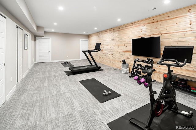 workout room featuring visible vents, recessed lighting, wood walls, carpet flooring, and baseboards