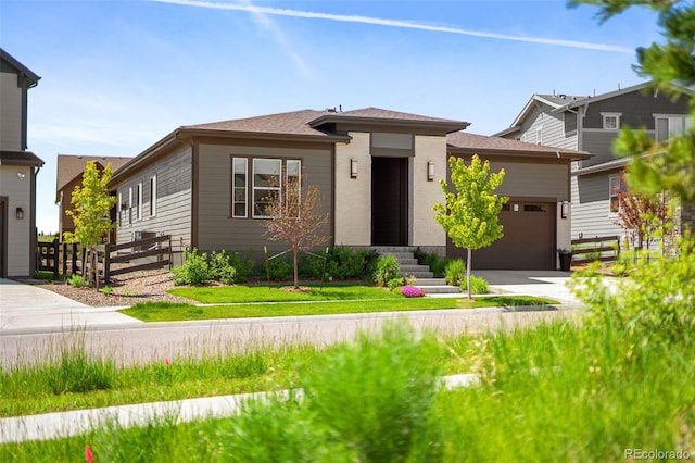 6530 Barnstead Dr, Castle Pines, CO 80108 - view of front facade featuring an attached garage, concrete driveway, and a shingled roof