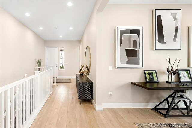 6530 Barnstead Dr, Castle Pines, CO 80108 - corridor featuring light wood finished floors and recessed lighting
