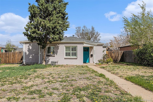 3640 N Saint Paul St, Denver, CO 80205 - view of front of home featuring a fenced backyard and brick siding