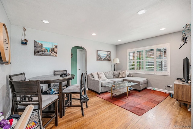 3640 N Saint Paul St, Denver, CO 80205 - living room featuring arched walkways, light wood-style floors, and recessed lighting