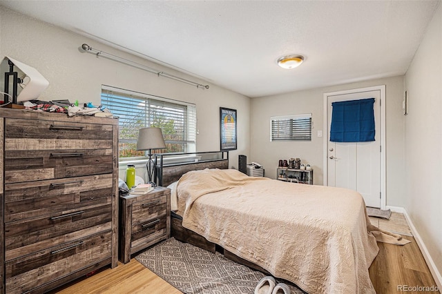 3640 N Saint Paul St, Denver, CO 80205 - bedroom with light wood finished floors and baseboards