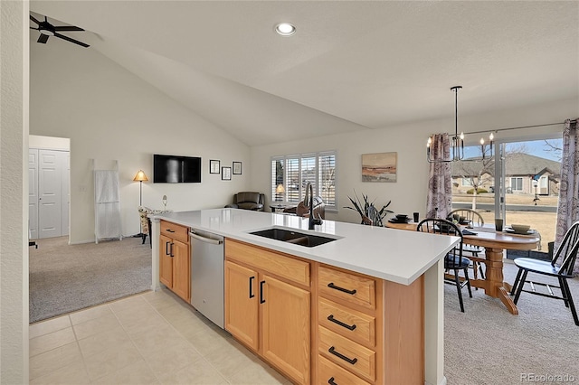 kitchen with light carpet, a sink, open floor plan, light countertops, and dishwasher