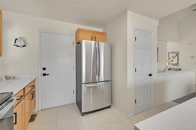 kitchen with light countertops, appliances with stainless steel finishes, and visible vents