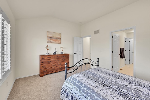 bedroom with light colored carpet, visible vents, lofted ceiling, and baseboards