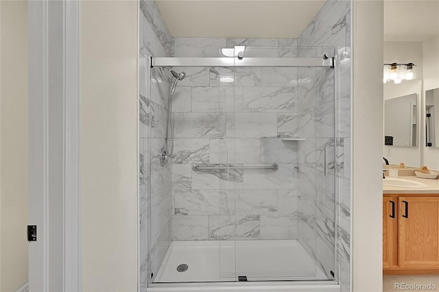 full bath featuring a stall shower and vanity