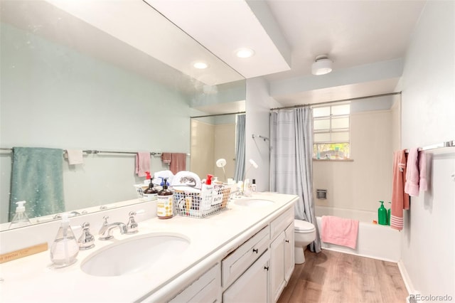 9540 E Grand Pl, Greenwood Village, CO 80111 - full bathroom featuring toilet, wood finished floors, double vanity, shower / bath combination with curtain, and baseboards