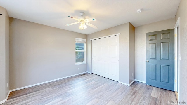 15926 Butterwort Cir, Parker, CO 80134 - unfurnished bedroom featuring wood finished floors, a closet, and ceiling fan