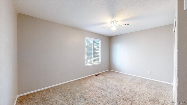 15926 Butterwort Cir, Parker, CO 80134 - carpeted spare room with baseboards and a ceiling fan