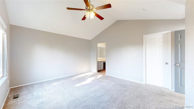 15926 Butterwort Cir, Parker, CO 80134 - unfurnished bedroom featuring light carpet, vaulted ceiling, and ensuite bathroom