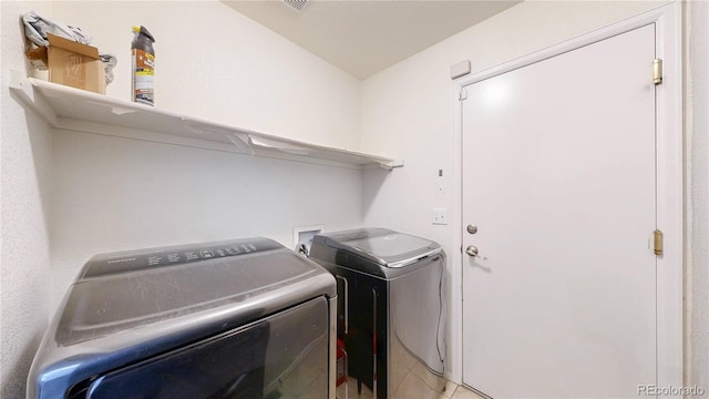 15926 Butterwort Cir, Parker, CO 80134 - laundry room featuring washing machine and clothes dryer
