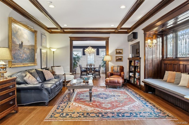 living room with a notable chandelier, crown molding, beamed ceiling, and hardwood / wood-style flooring