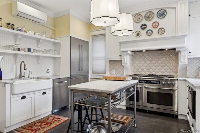 kitchen with a wall unit AC, white cabinetry, and appliances with stainless steel finishes