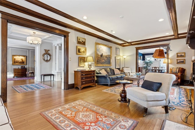 living room with ornamental molding and hardwood / wood-style floors