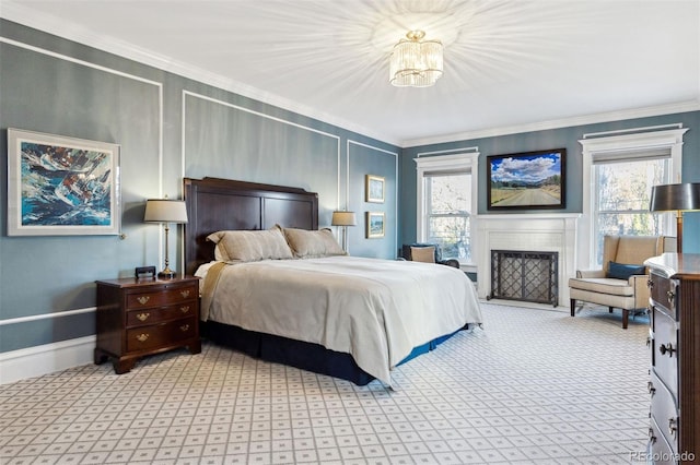 bedroom with a notable chandelier, light colored carpet, ornamental molding, and multiple windows