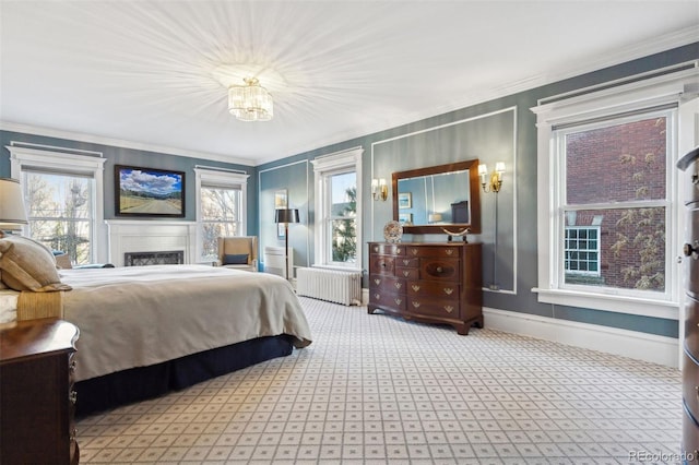 bedroom featuring carpet flooring, radiator heating unit, and crown molding