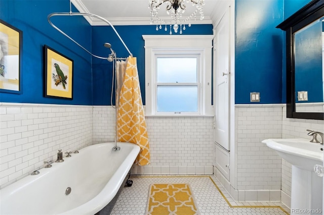 bathroom with tile walls, tile patterned flooring, crown molding, and a chandelier