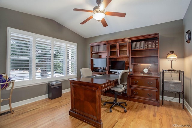 office with ceiling fan, baseboards, lofted ceiling, and light wood-style floors