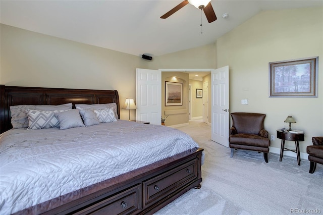 bedroom with baseboards, light colored carpet, ceiling fan, and lofted ceiling