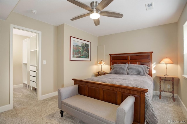 bedroom featuring a ceiling fan, baseboards, light colored carpet, and visible vents
