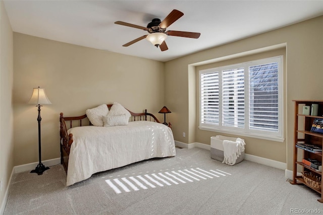bedroom featuring baseboards, carpet, and a ceiling fan