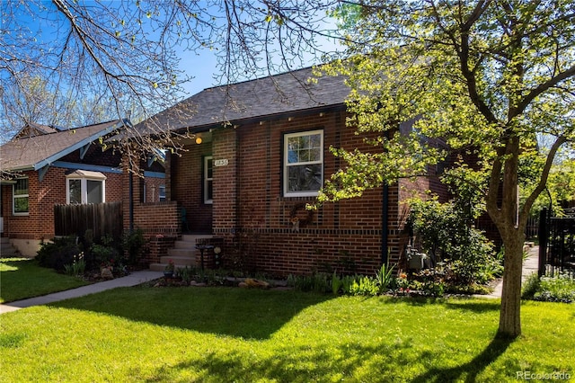 view of front of home featuring brick siding