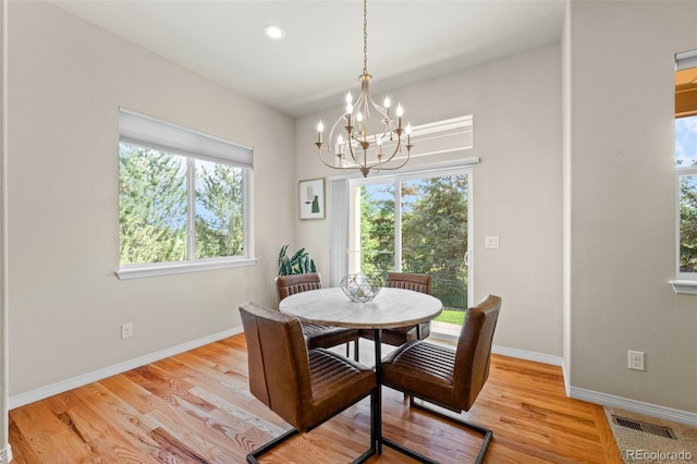 15414 Xenia Ct, Thornton, CO 80602 - dining area with a chandelier, healthy amount of natural light, light wood finished floors, and recessed lighting
