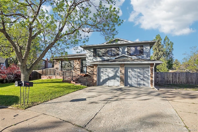 tri-level home with concrete driveway and brick siding