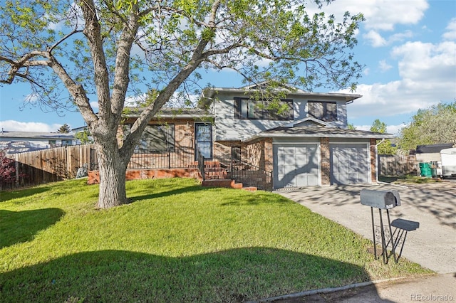 tri-level home with driveway, brick siding, and a garage