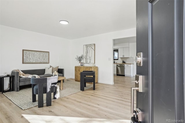 living room with light wood-style floors and baseboards