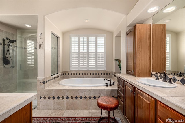 full bath featuring a bath, a tile shower, vanity, and recessed lighting
