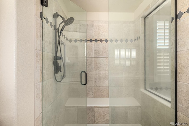 full bath with a shower stall
