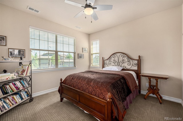carpeted bedroom with baseboards and ceiling fan