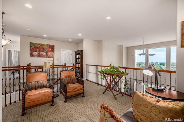 living area featuring recessed lighting, carpet flooring, an upstairs landing, and ceiling fan