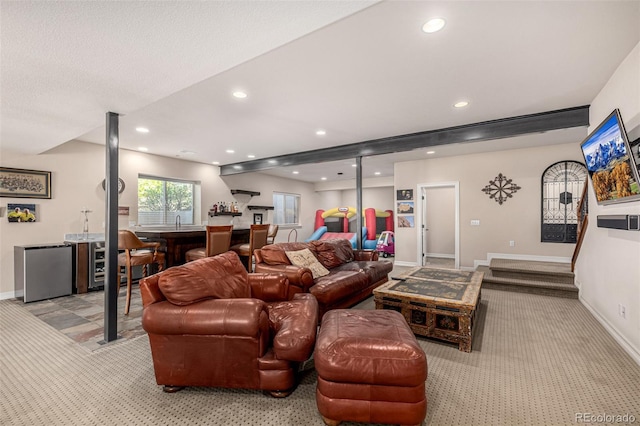 living room with light colored carpet, recessed lighting, baseboards, and bar