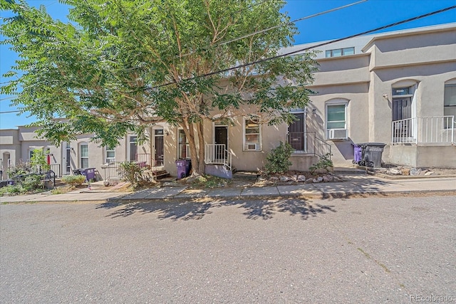 view of front of property featuring cooling unit