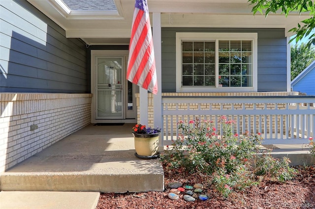 doorway to property featuring a porch